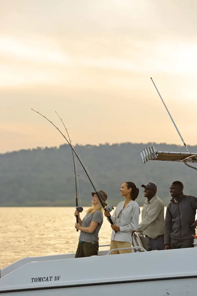 Guests enjoying fishing at sunset on Lake Victoria at Rubondo Island