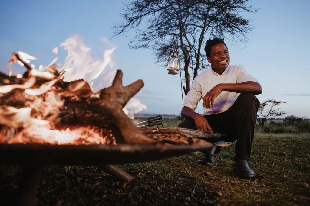 campfire in the Serengeti in Usawa migration camp